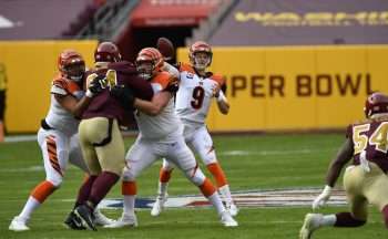 Bengals quarterback Joe Burrow throws as guard Michael Jordan and tackle Jonah Williams pass block during the Cincinnati Bengals vs. Washington Football Team NFL game at FedEx Field on November 22, 2020 in Landover, MD.