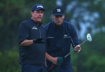 Phil Mickelson reads a putt for NFL quarterback Tom Brady during The Match: Champions For Charity at Medalist Golf Club on May 24, 2020.