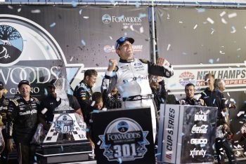 Aric Almirola, driver of the Stewart-Haas Racing No. 10 Ford, celebrates winning the Foxwoods Resort Casino 301 on July 18, 2021, at New Hampshire Motor Speedway in Loudon, New Hampshire.