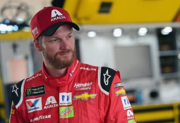 Dale Earnhardt Jr. stands in the garage area in 2017.