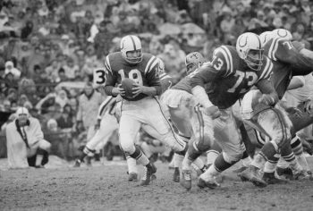 Johnny Unitas drops back to pass.