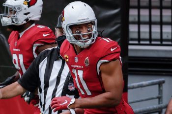 Arizona Cardinals wide receiver Larry Fitzgerald smiles as he jogs onto the field before a game.