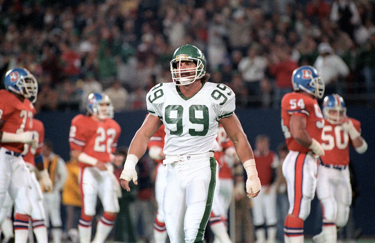 Mark Gastineau celebrates the New York Jets victory over the Miami