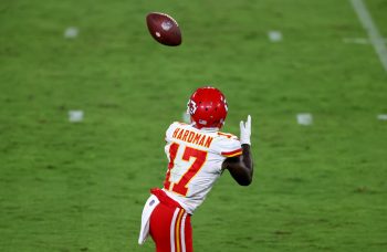 Kansas City Chiefs receiver Mecole Hardman runs under a touchdown pass from Patrick Mahomes.