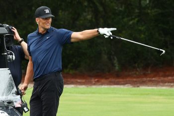 Tom Brady gestures on the golf course during The Match.