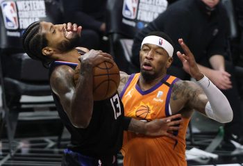 Torrey Craig fouls Paul George.