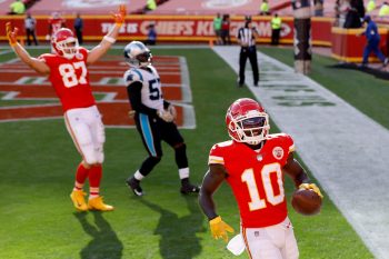 Kansas City Chiefs tight end Travis Kelce celebrates teammate Tyreek Hill's touchdown catch.