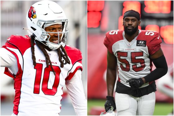 DeAndre Hopkins signals a first down as Arizona Cardinals teammate Chandler Jones jogs onto the field before practice.