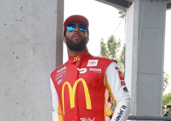 Bubba Wallace, driver of the No. 23 Toyota, waits on the grid prior to the NASCAR Cup Series Verizon 200 at tndianapolis Motor Speedway.