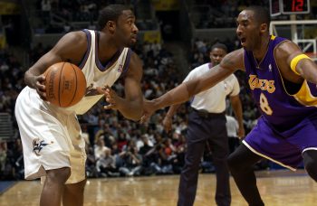 Kobe Bryant (R) defends Gilbert Arenas (R) in 2005.