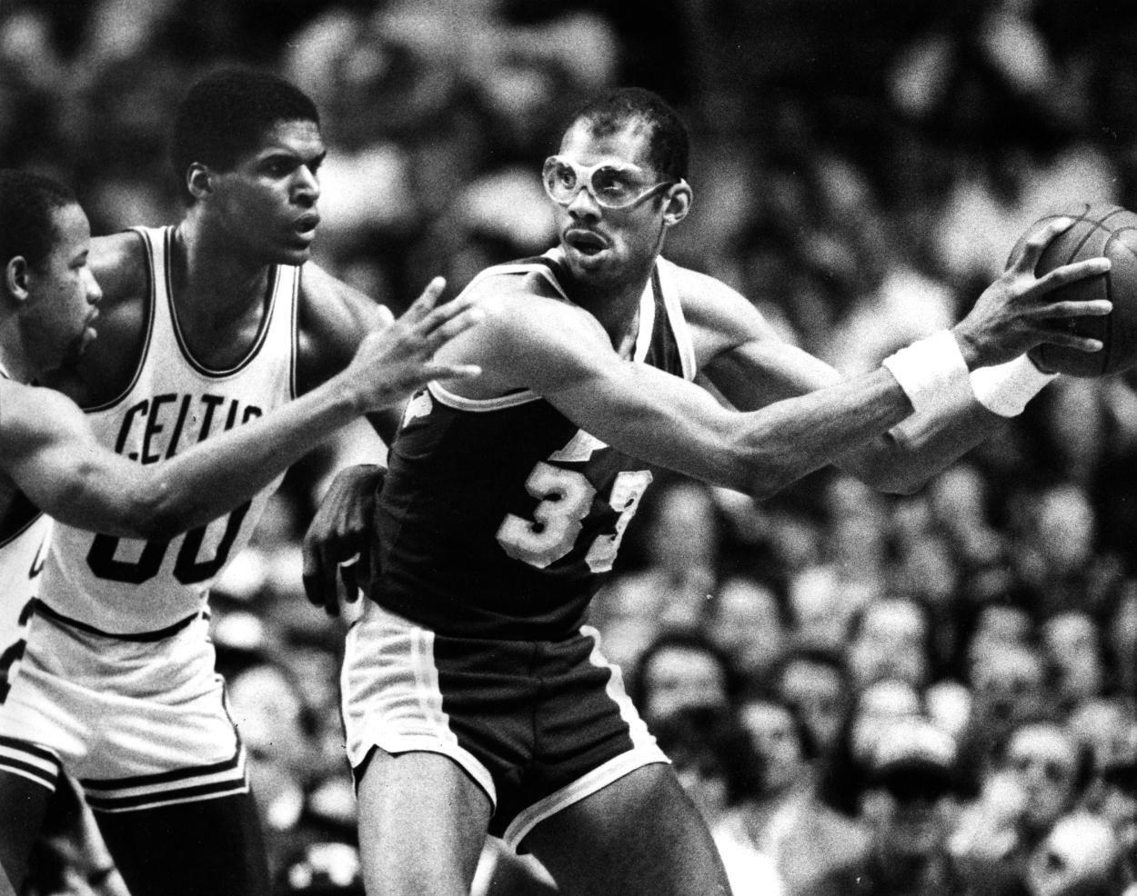 Los Angeles Lakers' Kareem Abdul-Jabbar is guarded by the Celtics' Robert Parish and Ray Williams, far left, during Game 2 of the 1985 NBA Finals.