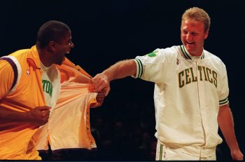 Magic Johnson, left, pays tribute to fellow basketball legend Larry Bird.