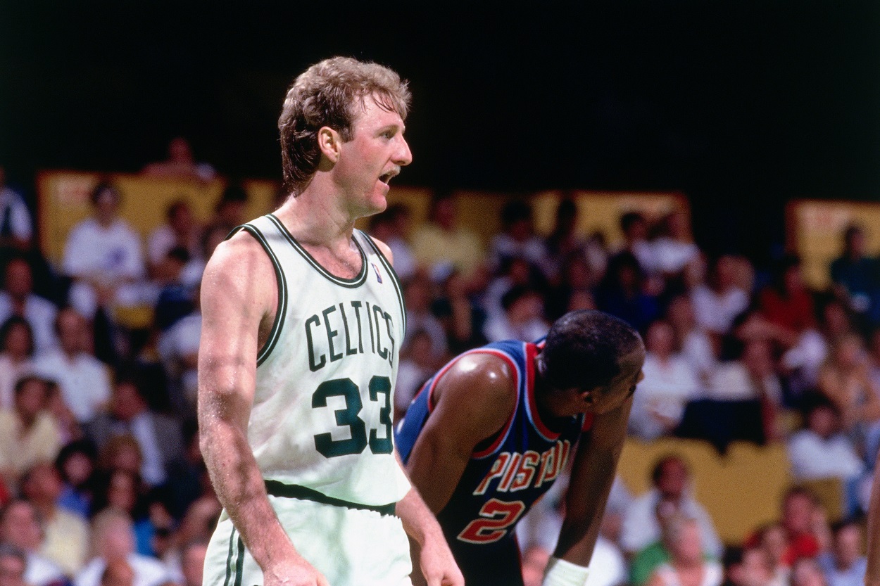 Patrick Ewing of the New York Knicks rebounds against Larry Bird