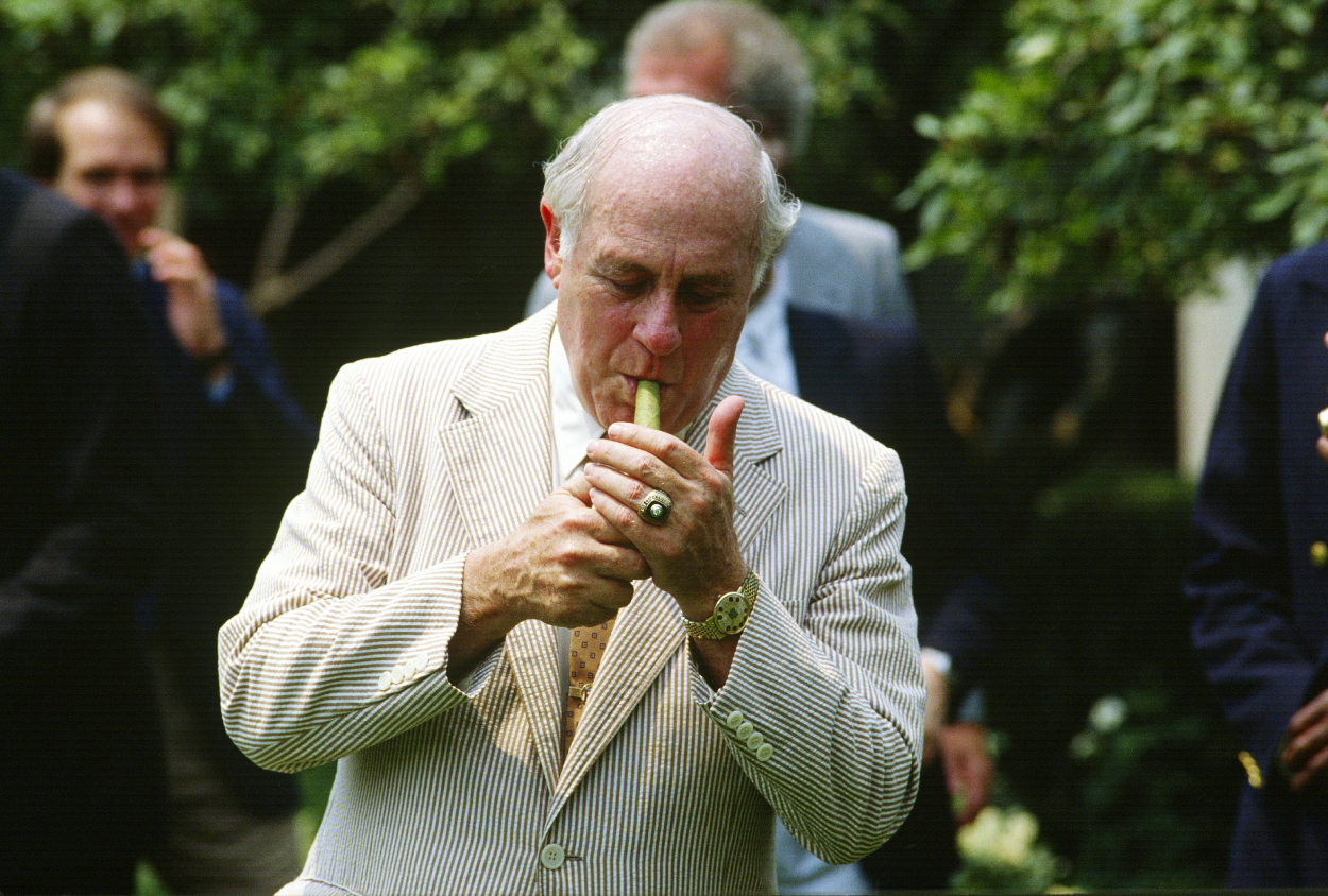 Why Did Red Auerbach Smoke All Those Cigars And Hold A Rolled Up Game