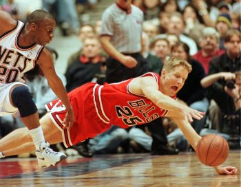 Chicago Bulls guard Steve Kerr dives to corral a loose ball.