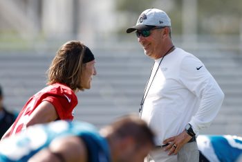 Jacksonville Jaguars head coach Urban Meyer speaks to Trevor Lawrence during warmups.