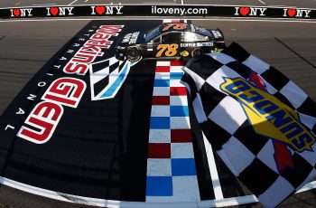 Martin Truex Jr. crosses the finish line at Watkins Glen International to win the 2017 NASCAR Cup Series I Love NY 355