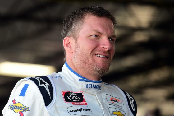 Dale Earnhardt Jr. stands in garage