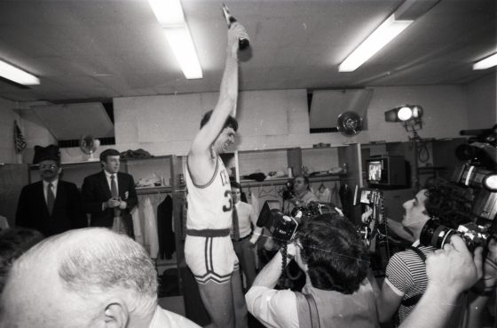 Boston Celtics player Kevin McHale celebrates the team's NBA championship in the locker room after Game 7 of the NBA Finals outside of the Boston Garden in Boston on June 12, 1984. .