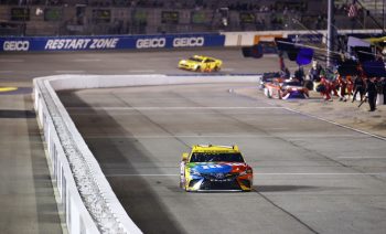 Kyle Busch drives down pit road