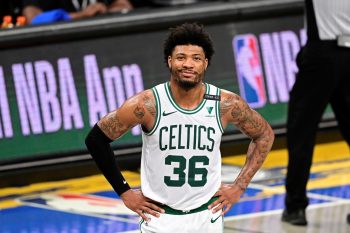 Marcus Smart of the Boston Celtics grins during a game against the Brooklyn Nets.