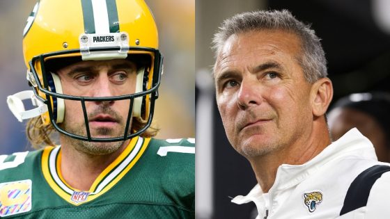 (L-R) Aaron Rodgers of the Green Bay Packers, seen here on the field during pregame against the Pittsburgh Steelers at Lambeau Field on October 03, 2021, recently weighed in on the Urban Meyer scandal; Head coach Urban Meyer of the Jacksonville Jaguars looks on before the game against the Cincinnati Bengals at Paul Brown Stadium on September 30, 2021 in Cincinnati, Ohio.