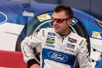 Joey Hand waits in the paddock before the IMSA WeatherTech Series race at Road America on Aug. 7, 2016, in Elkhart Lake, Wisconsin.