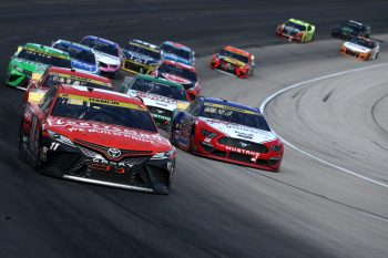 Joey Logano and Denny Hamlin race at Texas