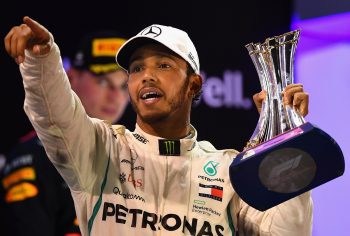 Race winner Lewis Hamilton of Great Britain celebrates on the podium during the Abu Dhabi Formula One Grand Prix at Yas Marina Circuit on Nov. 25, 2018.