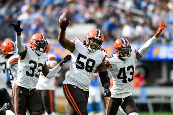 Malik McDowell celebrates recovering a fumble alongside his Cleveland Browns teammates.