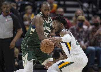 Khris Middleton of the Milwaukee Bucks pressures Donovan Mitchell of the Utah Jazz.