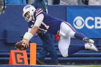 Quarterback Josh Allen of the Buffalo Bills, who talked about smashing tables with Bills Mafia on 'Monday Night Football,' reaches with the ball for the end zone against the Houston Texans during the game at Highmark Stadium on October 03, 2021 in Orchard Park, New York.