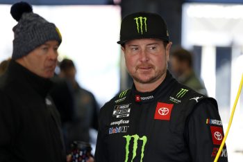 Kurt Busch watches crew work on car