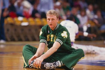 Boston Celtics star Larry Bird stretches before a game.