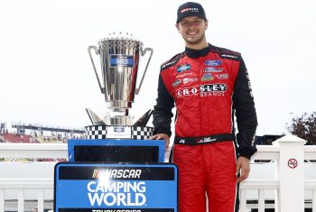 Todd Gilliland, driver of the No. 38 Ford, poses for photos after the NASCAR Camping World Truck Series United Rentals 176 at Watkins Glen International on Aug. 07, 2021.