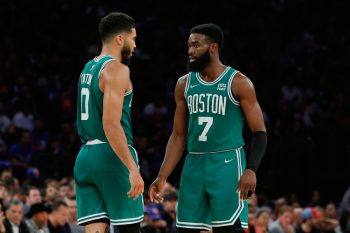 Jaylen Brown, right, talks with Jayson Tatum.