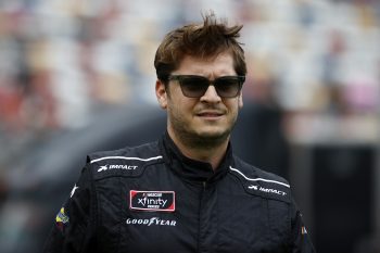 Landon Cassill walks the grid prior to the NASCAR Xfinity Series Drive for the Cure 250 at Charlotte Motor Speedway on Oct. 9, 2021.