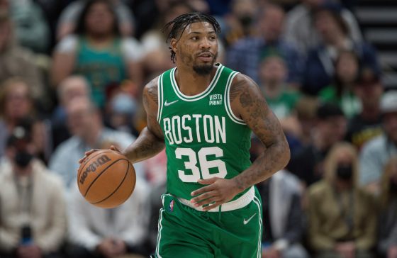 Marcus Smart of the Boston Celtics brings the ball up the court.