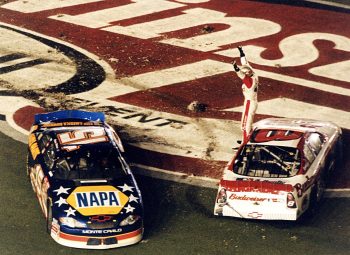 Dale Earnhardt Jr. stands on car