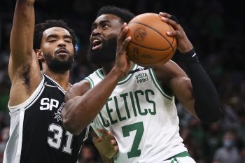 Jaylen Brown of the Boston Celtics drives to the basket past Keita Bates-Diop of the San Antonio Spurs.