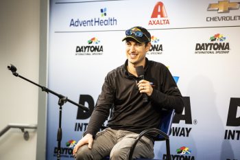 Joey Logano talks with media