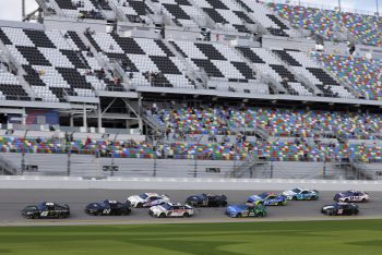 Joey Logano races Kurt Busch