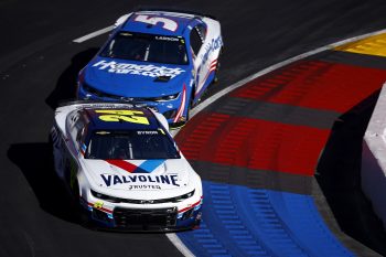 William Byron Jr., driver of the No. 24 Chevrolet, and Kyle Larson, driver of the No. 5 Chevrolet, drive during practice for the NASCAR Cup Series Busch Light Clash at Los Angeles Coliseum on Feb. 5, 2022.