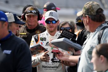 Dale Earnhardt Jr. signs autographs