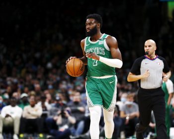 Jaylen Brown of the Boston Celtics brings the ball up court.