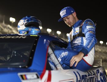 Kyle Larson, driver of the No. 5 Chevrolet, exits his car after qualifying in the pole position for the NASCAR Cup Series Daytona 500.