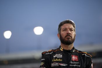 Martin Truex Jr. stands on grid