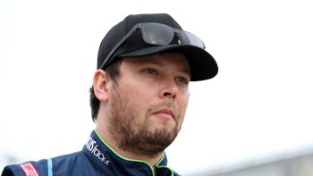 Erik Jones, driver of the No. 43 Chevrolet, walks the garage area during practice for the NASCAR Cup Series Daytona 500 on Feb. 15, 2022.