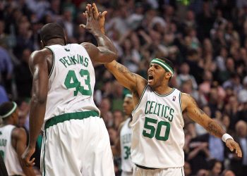 Boston Celtics guard Eddie House (50) celebrates with center Kendrick Perkins.