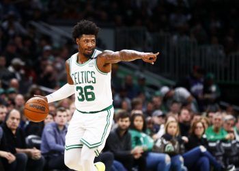 Marcus Smart of the Boston Celtics brings the ball up court.